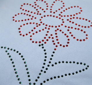 Rhinestone design on pale blue t-shirt